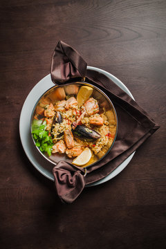 rice with chicken, seafood and tomatoes