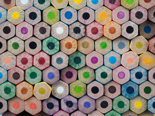 background of unsharpened bottoms of multi colored pencils