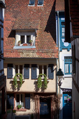 Beautiful house in Weinheim. Germany. Red tile roof, windows withblack and blue shutters, lantern. Doors.