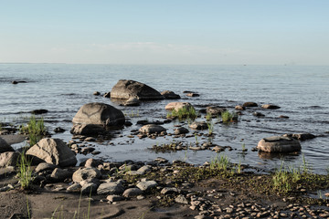 Fototapeta na wymiar rocks on the beach sea heart graffiti ocean landscape coastline sky shore coast seascape