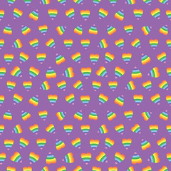 Scattered rainbow hearts on purple background. Pattern for fabric, wrapping, textile, wallpaper, apparel, background. Vector illustration
