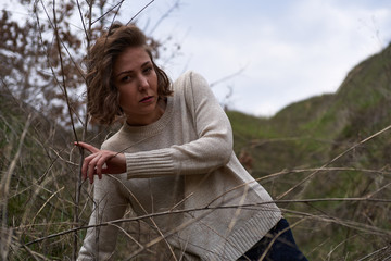 Beautiful girl in the canyon in the reeds, fashion shooting outdoors © Alexander