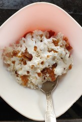 Assamese cuisine - Soft rice with cream and Jaggery. Soft rice variety is called Komal Chaul which is found only in Assam, India. This is ready to eat rice and requires on warm water