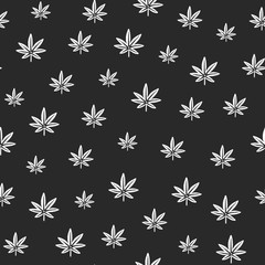 Seamless pattern with small white cannabis leaves on chalkboard