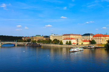 Fototapeta na wymiar View of the Vltava river with a boat in the summer. Prague. Czech Republic