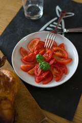 vegetarian food, raw tomatoes with basil leaf