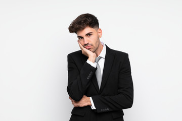 Young businessman over isolated white background unhappy and frustrated