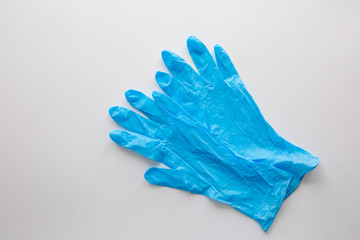 Blue medical gloves on a white background. Copy space. covid-19 protection. Coronavirus Epidemic