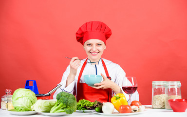 woman in cook hat. professional chef on red background. happy woman cooking healthy food by recipe. organic eating and vegetarian. Housewife. restaurant menu. Dieting. Who cares about diet