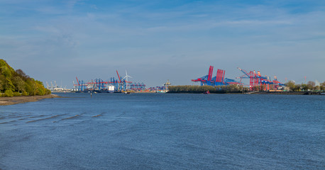 Fototapeta premium Hamburg, Germany. The river Elbe and the port on a sunny spring afternoon.