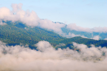 Fototapeta premium View landscape with silhouettes of mountains range with mist or covered by heavy fog