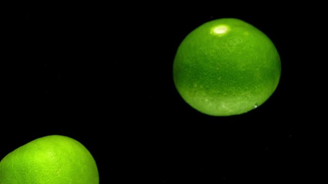 lime drop in water slower motion