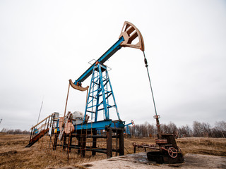 Green Oil pump oil rig energy industrial machine for petroleum crude. oil crisis. Russia pumps oil...