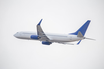 White passenger plane taking off