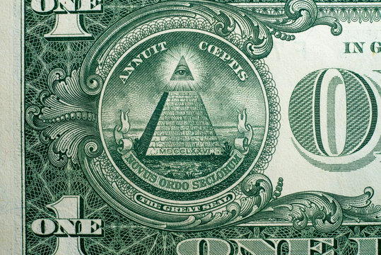 Annuit coeptis motto and the Eye of Providence on the reverse side of American one dollar bill.