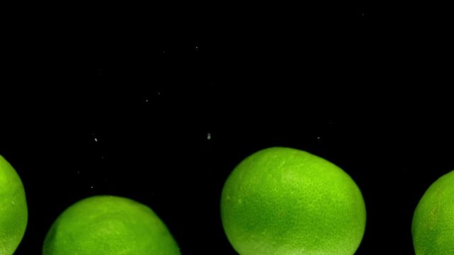 lime drop in water slower motion