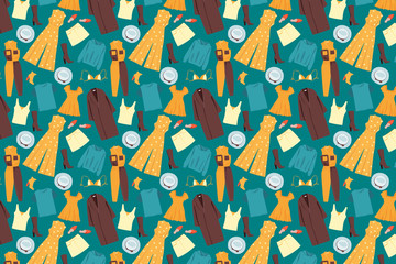 Obraz premium Different clothes on a green background. Fashion clothes