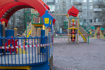 Fototapeta na wymiar The playground is closed due to the Covid19 virus. It is forbidden to be on the playground.