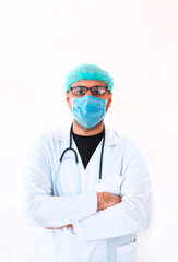 Portrait of a young male doctor in medical mask, sterile gloves and stethoscope while looking at camera on isolated white.