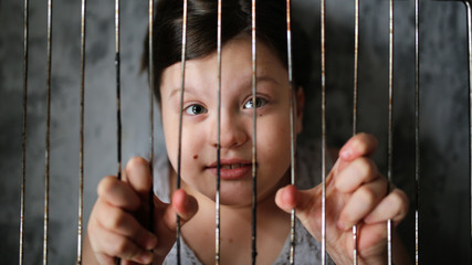 Kid in cage, concept freedom and rights of child
