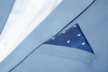 Close up of men's suit with pocket square.