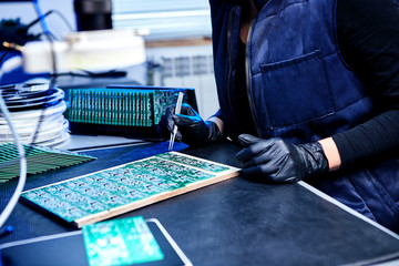 Engineer factory worker electronics works with a chip (board). Microchip Production, Nano computer...