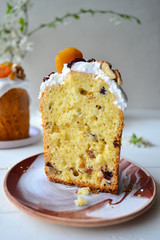 Traditional Easter cake with icing and dried fruit on top. Paska or kulich sponge cake.