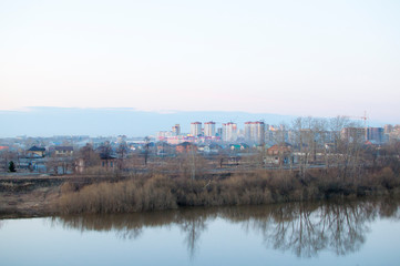 Fototapeta na wymiar View of the river neighbourhoods from the embankment. Tyumen, Russia.