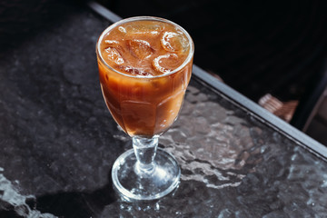 Orange iced coffee, summer cold drink in cafe on street, menu.