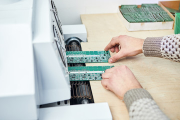 Engineer factory worker electronics works with a chip (board). Microchip Production, Nano computer...