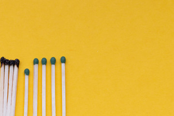 Matches are burning. One match prevents the spread of fire - the concept of how to stop the spread of coronavirus - keep your distance. Social distance concept for epidemic safety.