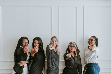 Professional women pointing the camera