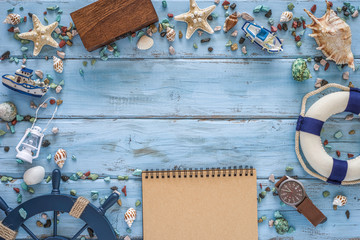 Summertime concept with lifeboat, rudder, seashells, starfishes, marine rubble on blue wooden...