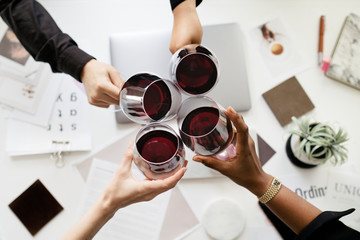 Professional business celebrating with wine