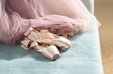 Ballet pointe shoes and tutu skirt. Distant training with, social distance or self-isolation, online education concept.