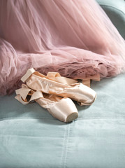 Ballet pointe shoes and tutu skirt. Distant training with, social distance or self-isolation, online education concept.