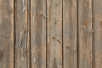 background of old wooden boards with cracks and nails