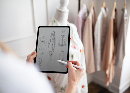 Fashion Designer Drawing On Tablet