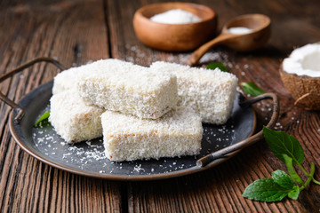 Delicious sweet dessert, white chocolate Lamingtons covered in grated coconut