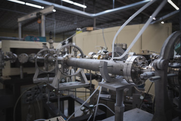 Beamline and Beamline Stands Aligned for Particle Accelerator in Research Laboratory