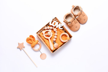 Set of baby shoes, toys and accessories on white background. Newborn stuff. Flat lay, top view