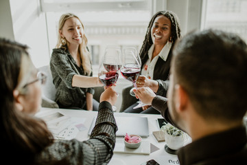 Professional business celebrating with wine