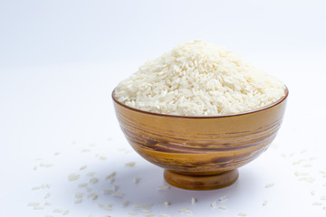 Close up a bowl of uncooked long grain white rice
