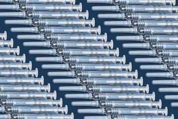 A graphic representation of a mass-produced syringe vaccines. The new syringes are labelled with...