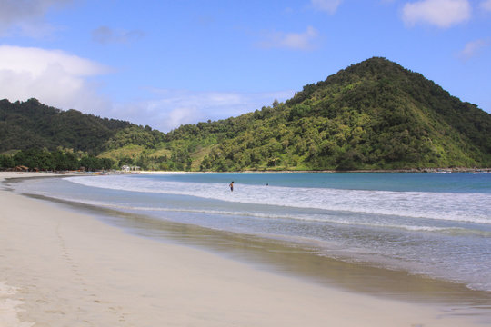 Sunny day on white sand Mawun beach Lombok