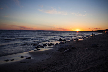 Fototapeta na wymiar Seashore during bright sundown. Composition of the nature.
