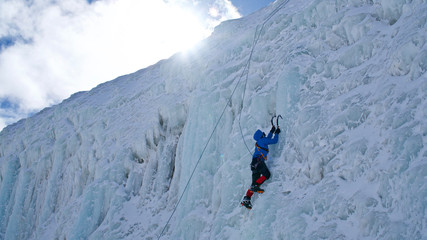 ERZURUM, TURKEY - FEBRUARY 28, 2020: Palandöken mountain ski resort. Skiing and snowboarding tourists. Young people doing ice climbing.