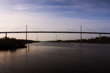 A sunrise Erskine bridge and river Clyde on a spring morning in Scotland.