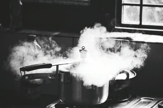 Close-up Of Steam Releasing Through Pressure Cooker
