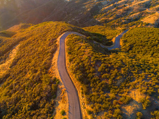 Aerial view of East Camino Cielo Road along the top of the Santa Ynez Mountains  at sunset , Santa Barbara, California